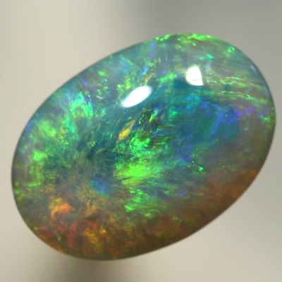 SOLID SEMI BLACK OPAL Pretty opal with orange bursting into greens and blues. SEE VIDEO